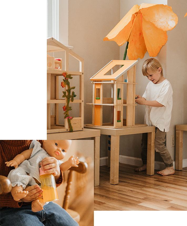 child playing with dollhouse and holding babydoll