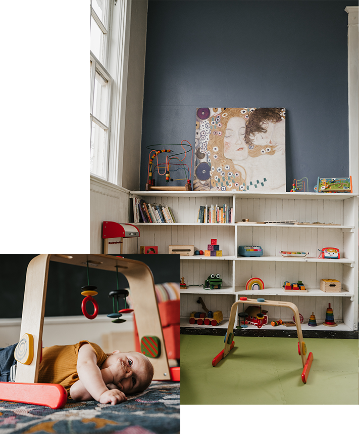 infant with toy and bookshelf with books and toys